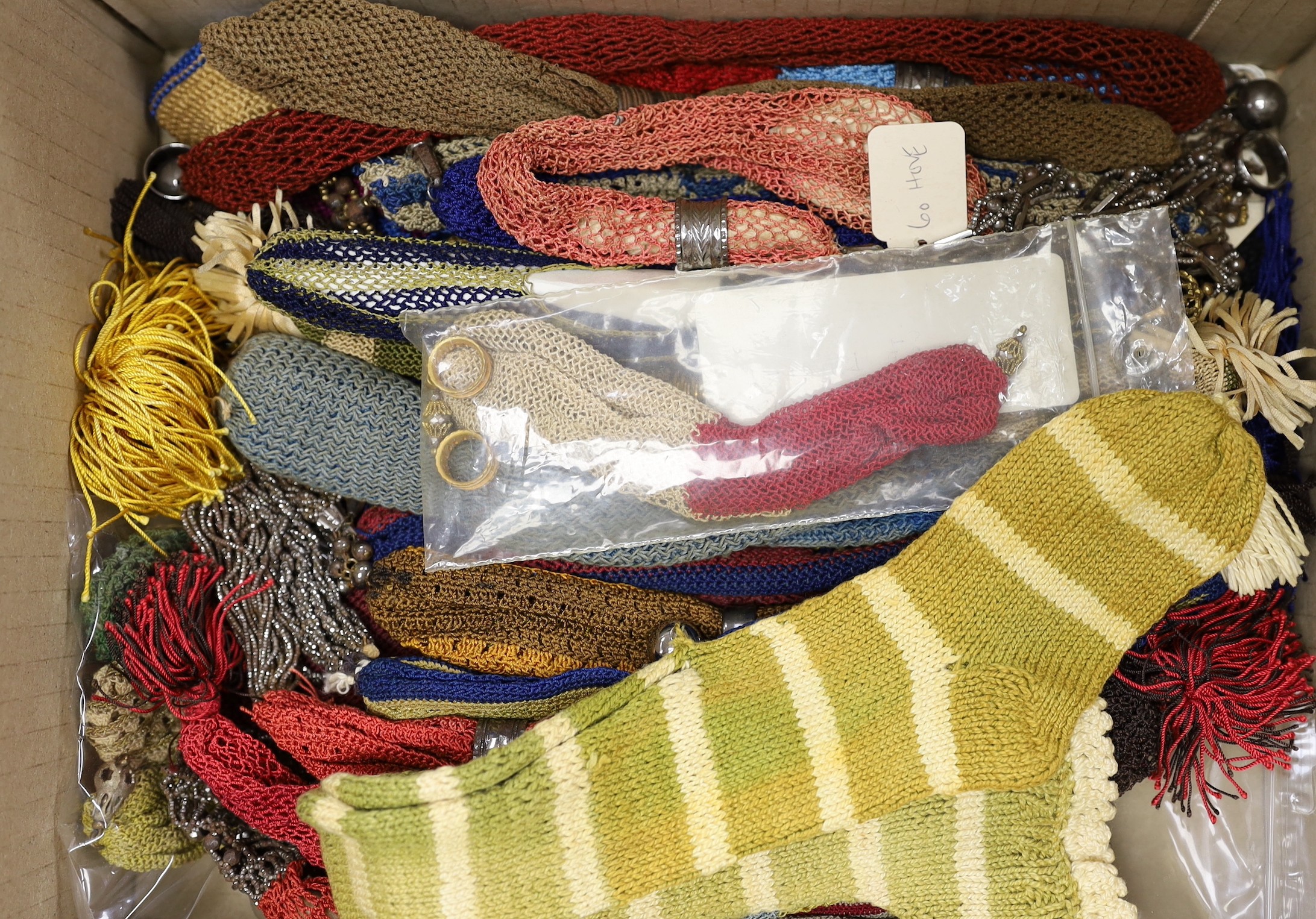 Twenty four mixed 19th century knitted misers purses and one knitted novelty ‘sock’ misers purse